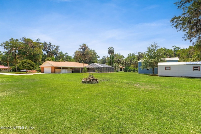 133 Divi Divi Dr, San Mateo, FL 32187 - view of grassy yard with a garage, a carport, and driveway