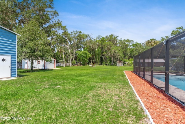 133 Divi Divi Dr, San Mateo, FL 32187 - view of green lawn with an outdoor pool, a lanai, and view of scattered trees