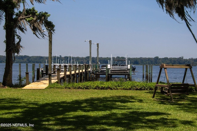 133 Divi Divi Dr, San Mateo, FL 32187 - dock area with boat lift, a water view, and a yard