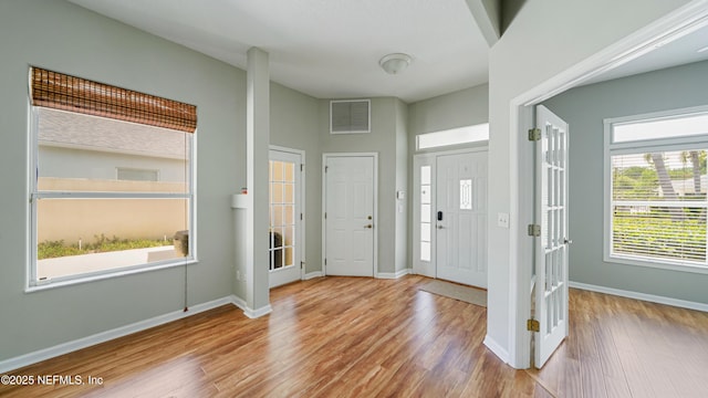 165 Cedar Ridge Cir, Saint Augustine, FL 32080 - entryway featuring wood finished floors, baseboards, and french doors