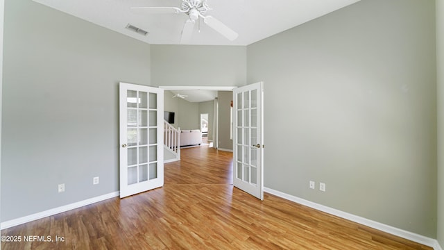 165 Cedar Ridge Cir, Saint Augustine, FL 32080 - unfurnished room with french doors, a ceiling fan, baseboards, and wood finished floors