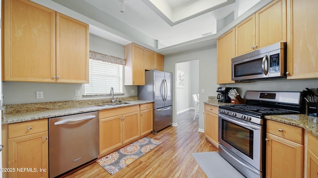 165 Cedar Ridge Cir, Saint Augustine, FL 32080 - kitchen with appliances with stainless steel finishes, a sink, and light brown cabinetry