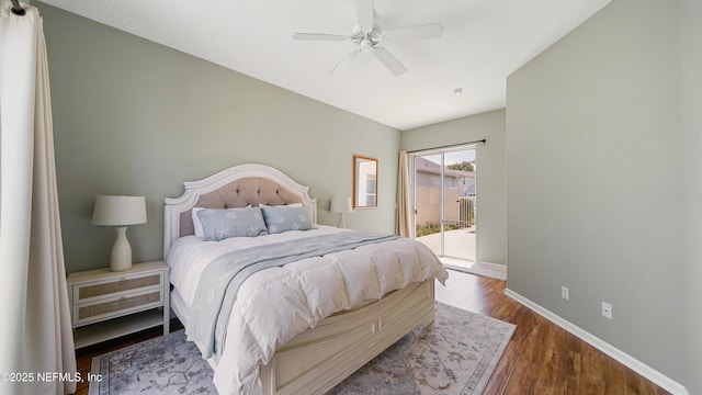 165 Cedar Ridge Cir, Saint Augustine, FL 32080 - bedroom with access to exterior, baseboards, wood finished floors, and ceiling fan
