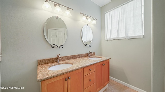 165 Cedar Ridge Cir, Saint Augustine, FL 32080 - full bathroom with double vanity, tile patterned floors, and baseboards