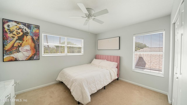 165 Cedar Ridge Cir, Saint Augustine, FL 32080 - bedroom featuring a closet, light carpet, and multiple windows