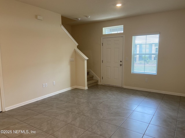 86768 Shortline Cir, Yulee, FL 32097 - entryway with tile patterned flooring, stairway, and recessed lighting
