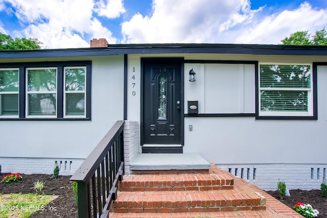 1470 River Hills Cir E, Jacksonville, FL 32211 - property entrance with crawl space and a chimney