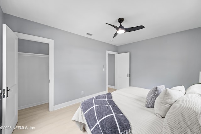 1470 River Hills Cir E, Jacksonville, FL 32211 - bedroom with light wood finished floors, a closet, a ceiling fan, and baseboards