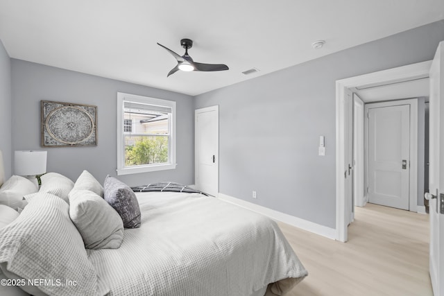 1470 River Hills Cir E, Jacksonville, FL 32211 - bedroom featuring light wood-style flooring, baseboards, and ceiling fan