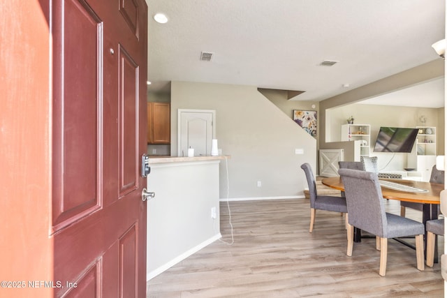 6033 Bartram Village Dr, Jacksonville, FL 32258 - foyer with light wood-type flooring and baseboards