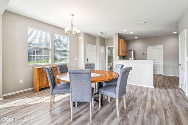 6033 Bartram Village Dr, Jacksonville, FL 32258 - dining room featuring light wood-style flooring, a chandelier, recessed lighting, and baseboards
