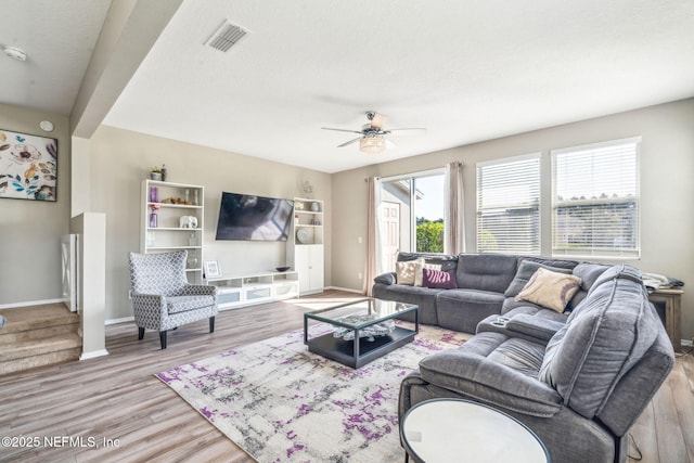6033 Bartram Village Dr, Jacksonville, FL 32258 - living area featuring ceiling fan, wood finished floors, and baseboards