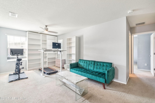 6033 Bartram Village Dr, Jacksonville, FL 32258 - carpeted living area featuring a ceiling fan, a textured ceiling, and baseboards