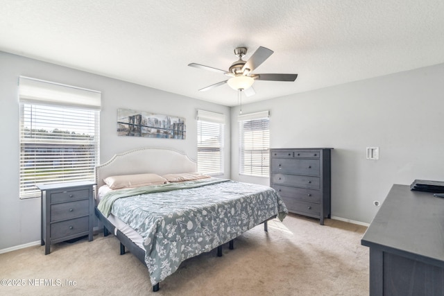 6033 Bartram Village Dr, Jacksonville, FL 32258 - bedroom with light colored carpet, baseboards, a textured ceiling, and a ceiling fan