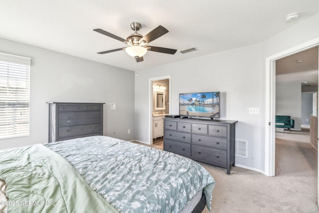 6033 Bartram Village Dr, Jacksonville, FL 32258 - bedroom with light carpet, baseboards, ceiling fan, and ensuite bath