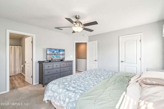 6033 Bartram Village Dr, Jacksonville, FL 32258 - bedroom with light colored carpet, baseboards, ceiling fan, and ensuite bathroom