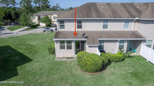 6033 Bartram Village Dr, Jacksonville, FL 32258 - rear view of house with stucco siding and a shingled roof