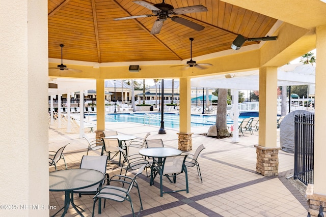 6033 Bartram Village Dr, Jacksonville, FL 32258 - view of patio / terrace featuring ceiling fan, a community pool, and a pergola