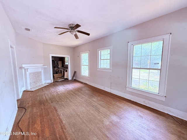 2771 Sunnyside St, Jacksonville, FL 32254 - unfurnished living room featuring wood finished floors, a ceiling fan, and baseboards