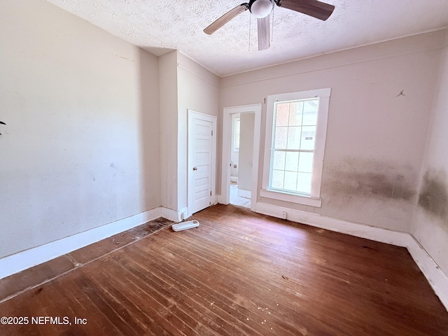 2771 Sunnyside St, Jacksonville, FL 32254 - spare room featuring a textured ceiling, wood finished floors, ceiling fan, and baseboards
