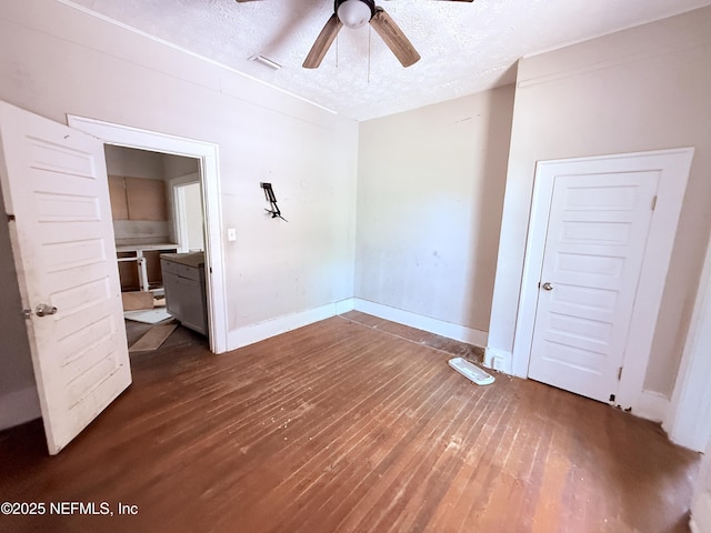 2771 Sunnyside St, Jacksonville, FL 32254 - empty room featuring ceiling fan, dark wood-style flooring, a textured ceiling, and baseboards