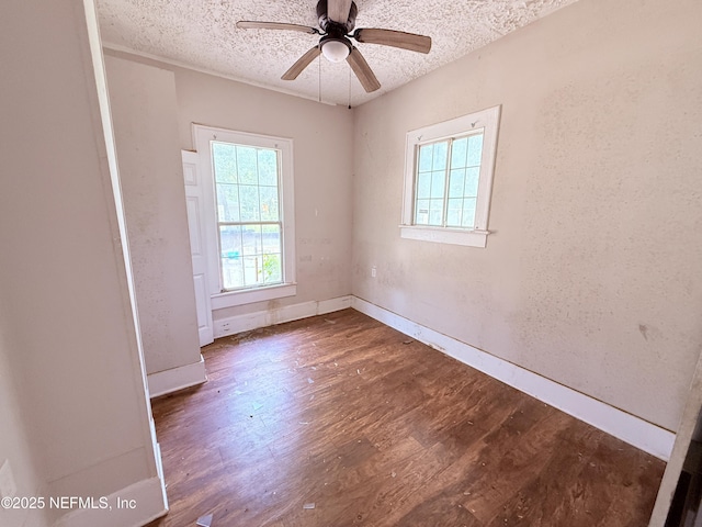2771 Sunnyside St, Jacksonville, FL 32254 - unfurnished room with a textured ceiling, wood finished floors, ceiling fan, and baseboards