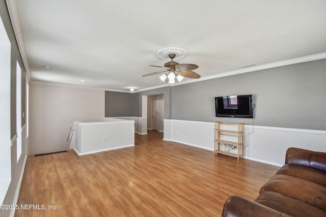 116 Nunna Rock Trl, Saint Augustine, FL 32092 - living area featuring wood finished floors, crown molding, ceiling fan, and baseboards