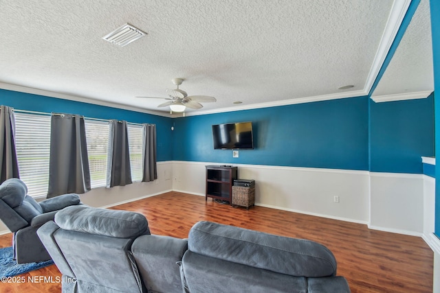 116 Nunna Rock Trl, Saint Augustine, FL 32092 - living area featuring wood finished floors, a textured ceiling, a ceiling fan, and crown molding