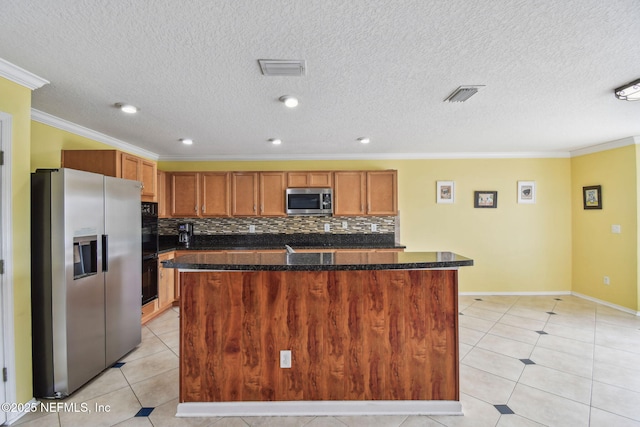 116 Nunna Rock Trl, Saint Augustine, FL 32092 - kitchen featuring stainless steel appliances, ornamental molding, light tile patterned flooring, brown cabinetry, and backsplash