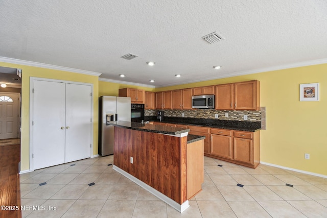 116 Nunna Rock Trl, Saint Augustine, FL 32092 - kitchen featuring stainless steel appliances, a center island, brown cabinetry, backsplash, and crown molding