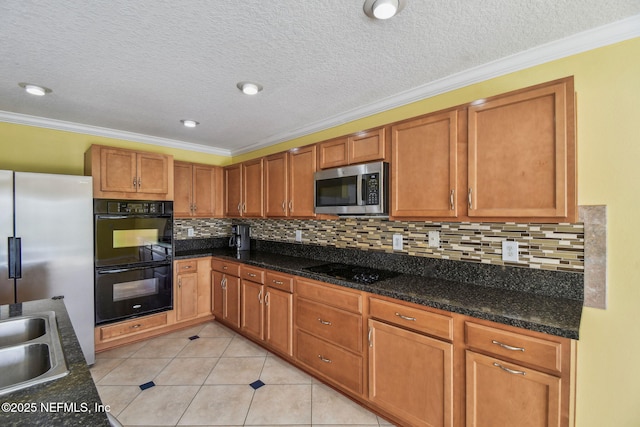 116 Nunna Rock Trl, Saint Augustine, FL 32092 - kitchen with black appliances, ornamental molding, light tile patterned floors, decorative backsplash, and brown cabinets