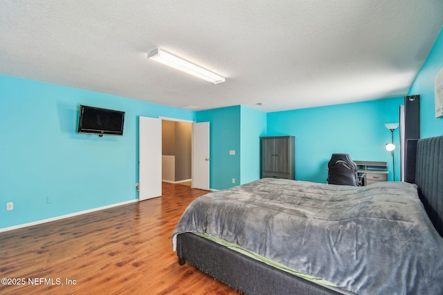 116 Nunna Rock Trl, Saint Augustine, FL 32092 - bedroom featuring wood finished floors, baseboards, and a textured ceiling