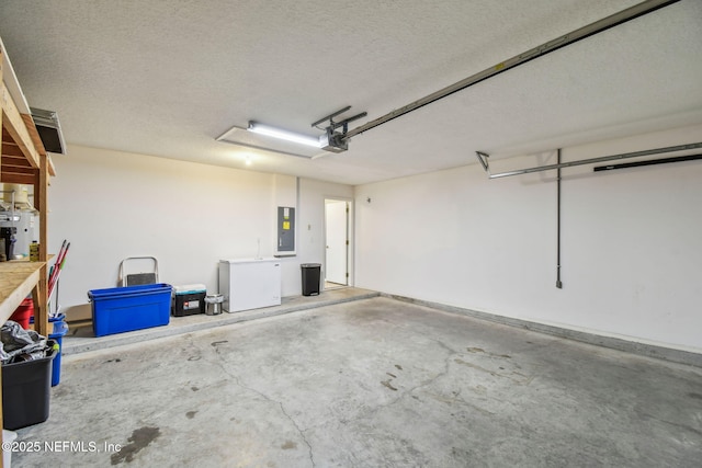 116 Nunna Rock Trl, Saint Augustine, FL 32092 - garage with electric panel, fridge, and a garage door opener