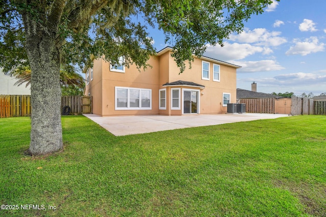 116 Nunna Rock Trl, Saint Augustine, FL 32092 - rear view of house featuring stucco siding, a patio area, central AC, and a gate