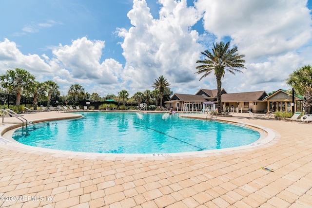 116 Nunna Rock Trl, Saint Augustine, FL 32092 - community pool featuring a patio area