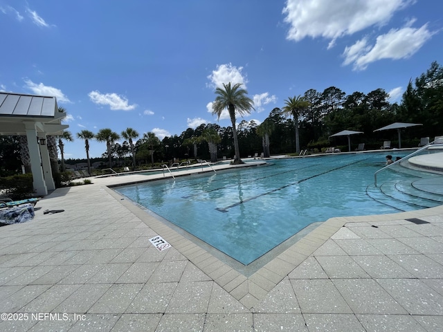 10312 Benson Lake Dr, Jacksonville, FL 32222 - community pool with a patio area