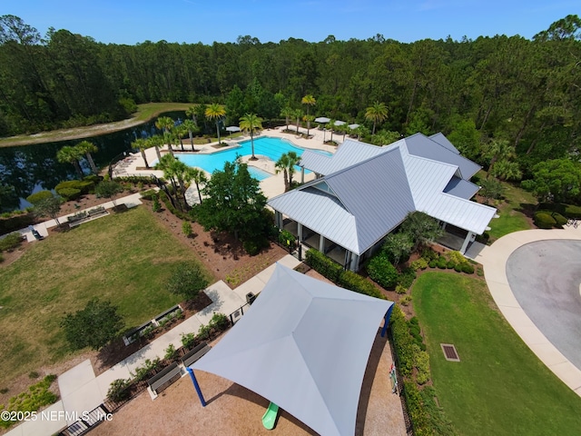 10312 Benson Lake Dr, Jacksonville, FL 32222 - aerial view of a heavily wooded area, a pool area, and a large body of water