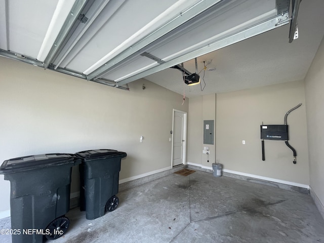 10312 Benson Lake Dr, Jacksonville, FL 32222 - garage featuring electric panel, a garage door opener, and baseboards