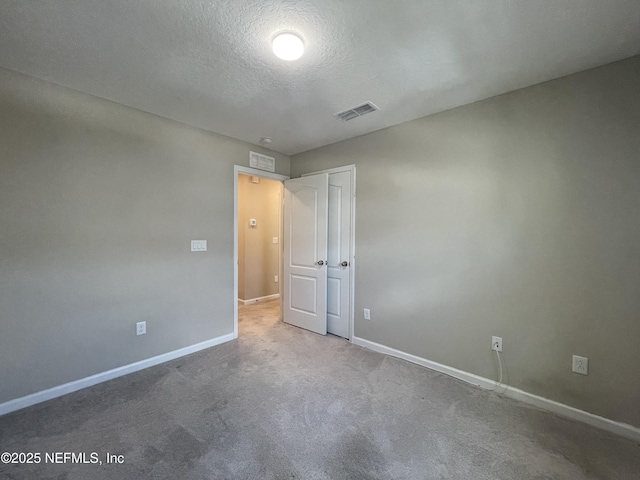 10312 Benson Lake Dr, Jacksonville, FL 32222 - unfurnished bedroom with baseboards, a textured ceiling, carpet floors, and a closet