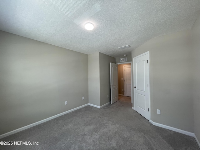 10312 Benson Lake Dr, Jacksonville, FL 32222 - unfurnished bedroom featuring a textured ceiling, baseboards, and carpet flooring