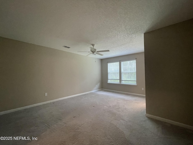 10312 Benson Lake Dr, Jacksonville, FL 32222 - carpeted spare room featuring a ceiling fan, baseboards, and a textured ceiling