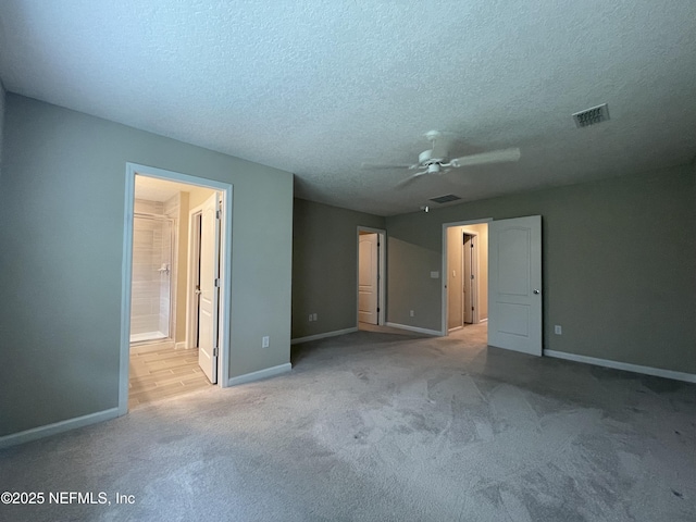 10312 Benson Lake Dr, Jacksonville, FL 32222 - unfurnished bedroom with baseboards, carpet floors, a textured ceiling, ensuite bathroom, and ceiling fan