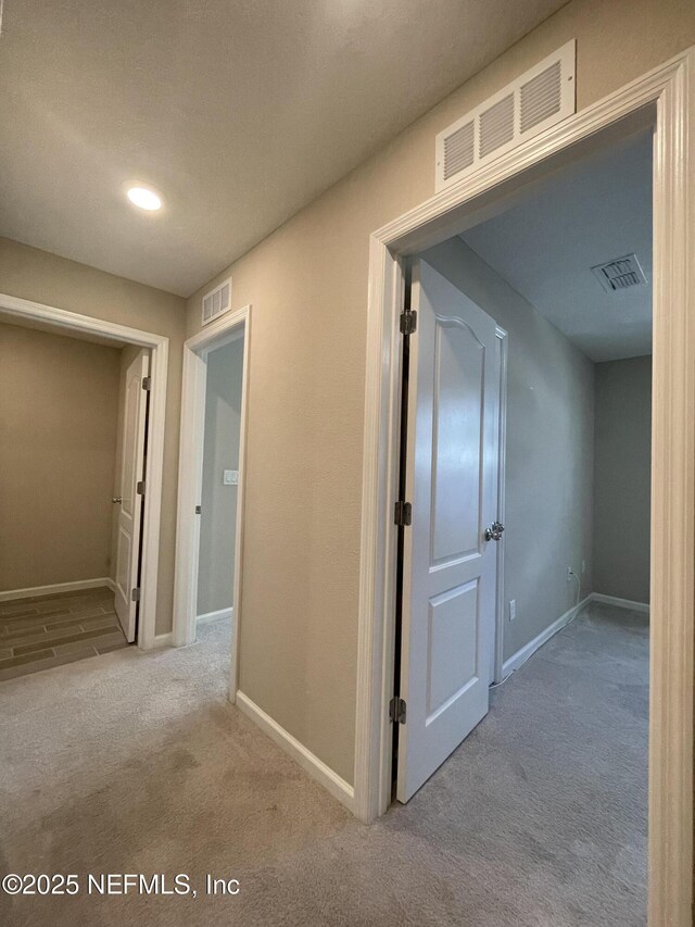10312 Benson Lake Dr, Jacksonville, FL 32222 - corridor featuring carpet and baseboards