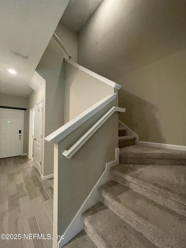 10312 Benson Lake Dr, Jacksonville, FL 32222 - stairs featuring baseboards and wood finished floors
