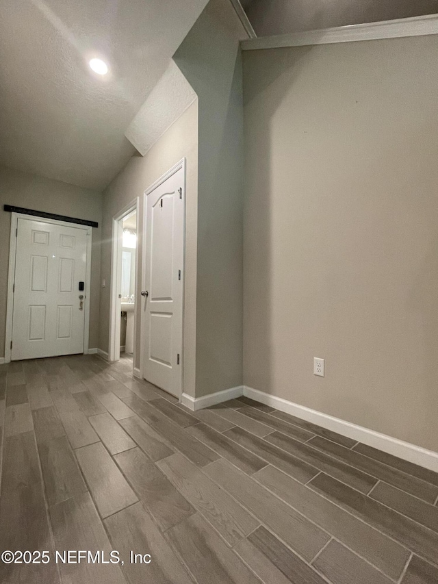 10312 Benson Lake Dr, Jacksonville, FL 32222 - foyer entrance with wood tiled floors, baseboards, and recessed lighting