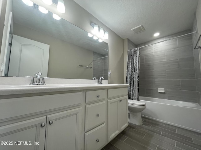 10312 Benson Lake Dr, Jacksonville, FL 32222 - bathroom featuring double vanity, toilet, shower / bath combination with curtain, wood tiled floors, and recessed lighting