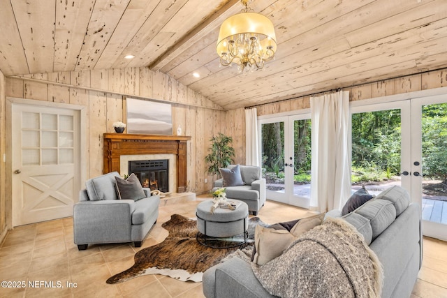 2153 Mills Rd, Jacksonville, FL 32216 - living area featuring french doors, lofted ceiling, light tile patterned flooring, wood walls, and a chandelier