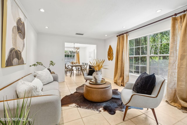 2153 Mills Rd, Jacksonville, FL 32216 - living area featuring light tile patterned flooring, a chandelier, baseboards, recessed lighting, and crown molding