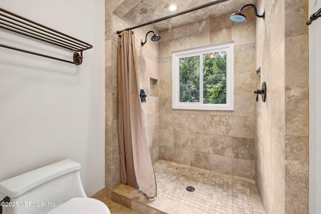 2153 Mills Rd, Jacksonville, FL 32216 - bathroom with tiled shower and toilet