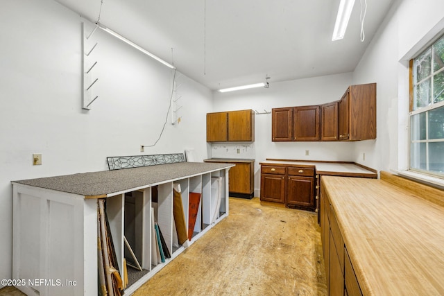 2153 Mills Rd, Jacksonville, FL 32216 - kitchen with brown cabinets and butcher block counters